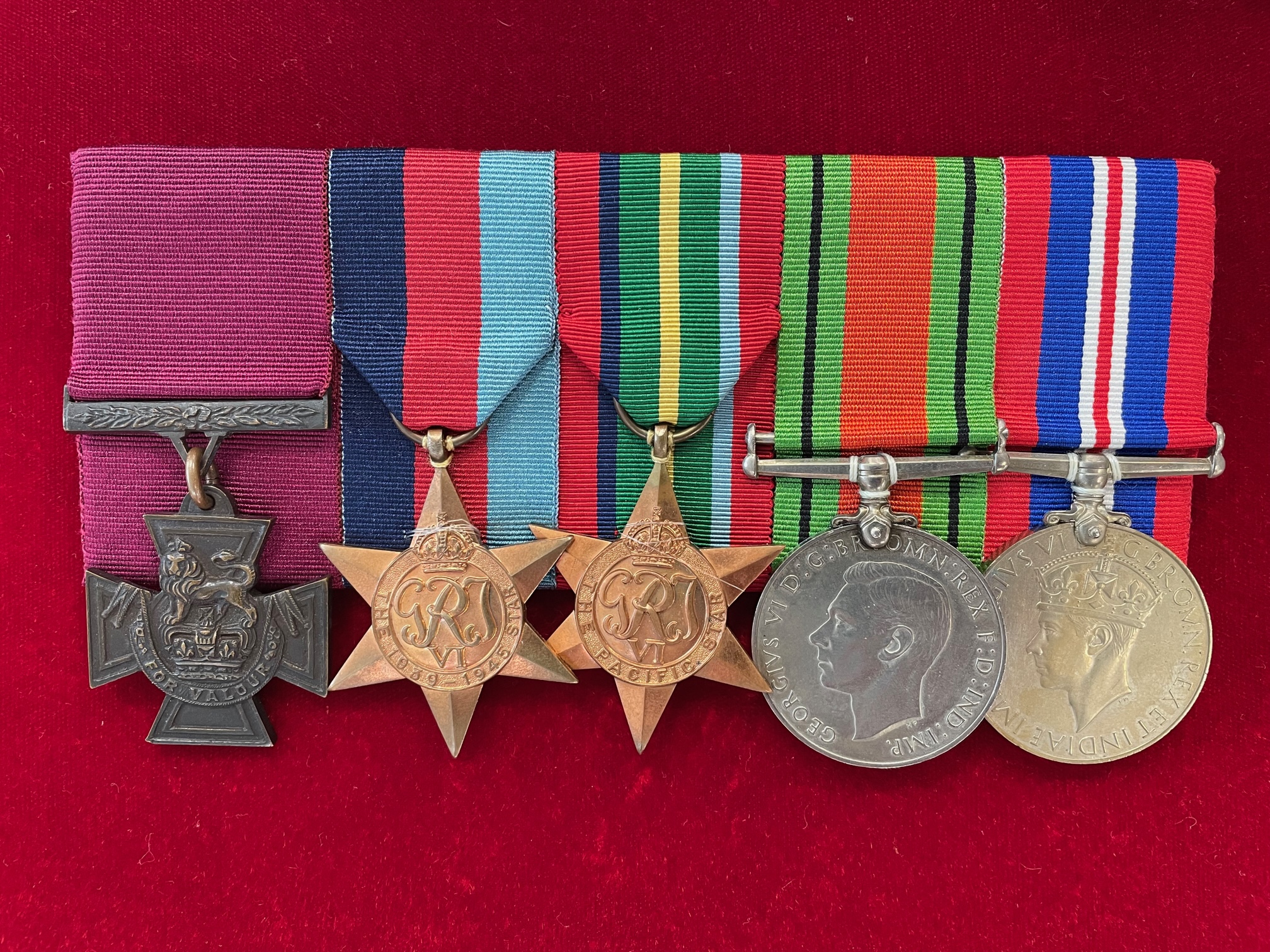 A row of five war medals including the Victoria Cross