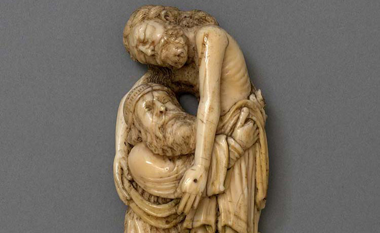 An ivory carving of Joseph of Arimathea lifting Christ's body from the cross