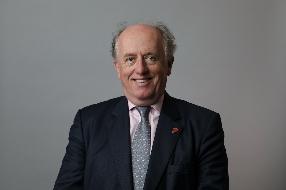 David Smart is looking at the camera and smiling