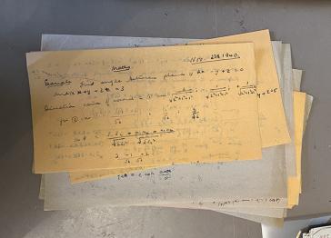 A pile of handwritten papers
