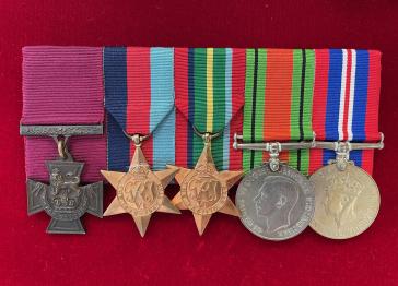 A row of five war medals including the Victoria Cross