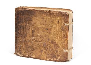 Closed lute manuscript with front cover facing camera it is aged and discoloured