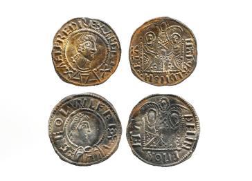 Two emperor pennies from the Herefordshire Hoard shown corroded from the front and back