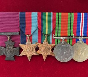 A row of five war medals including the Victoria Cross